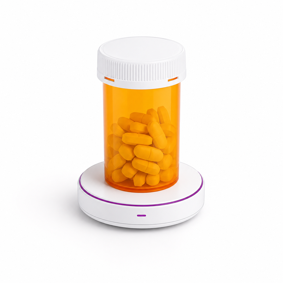 The LIVIT device — a low-profile disc that the pill bottle sits on