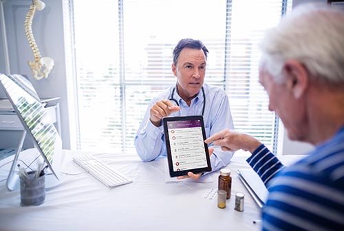 Provider reviewing LIVIT data with a patient
